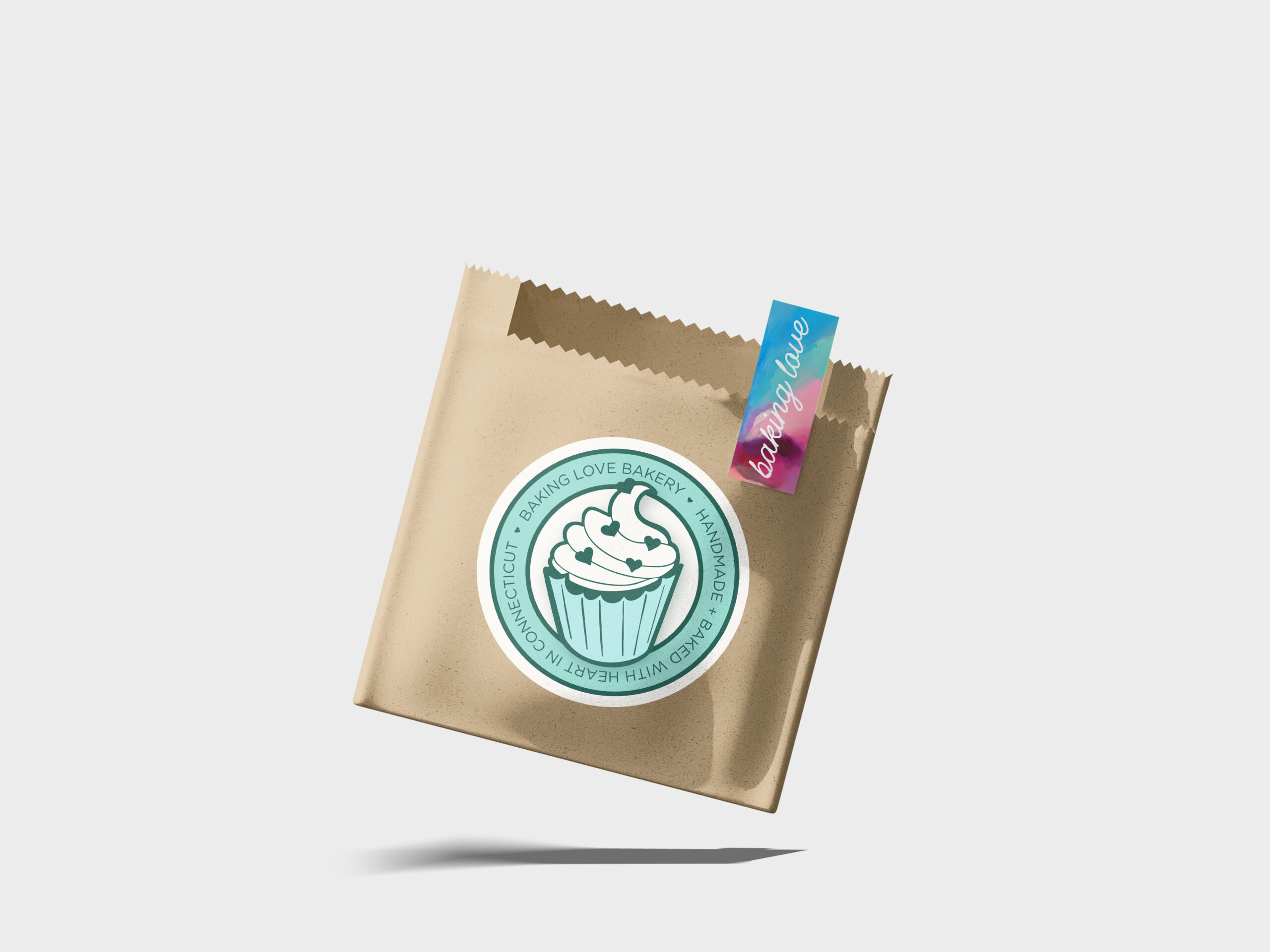 mockup of a pastry bag labeled with sticker of cupcake logo